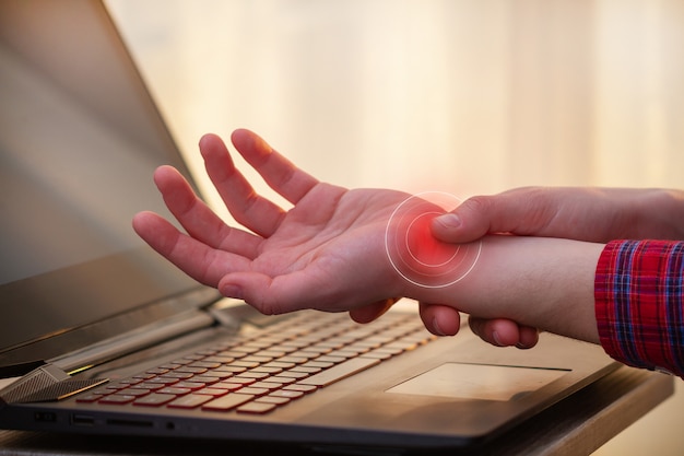 How can touch typing help with carpal tunnel syndrome?